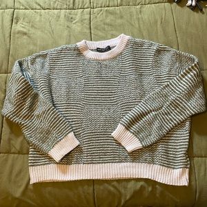 Green and white knit sweater